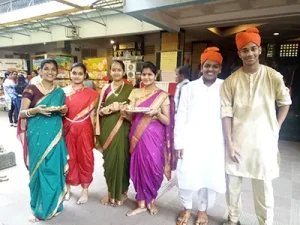 students in traditional Maharashtrian attire- welcoming parents on Open House